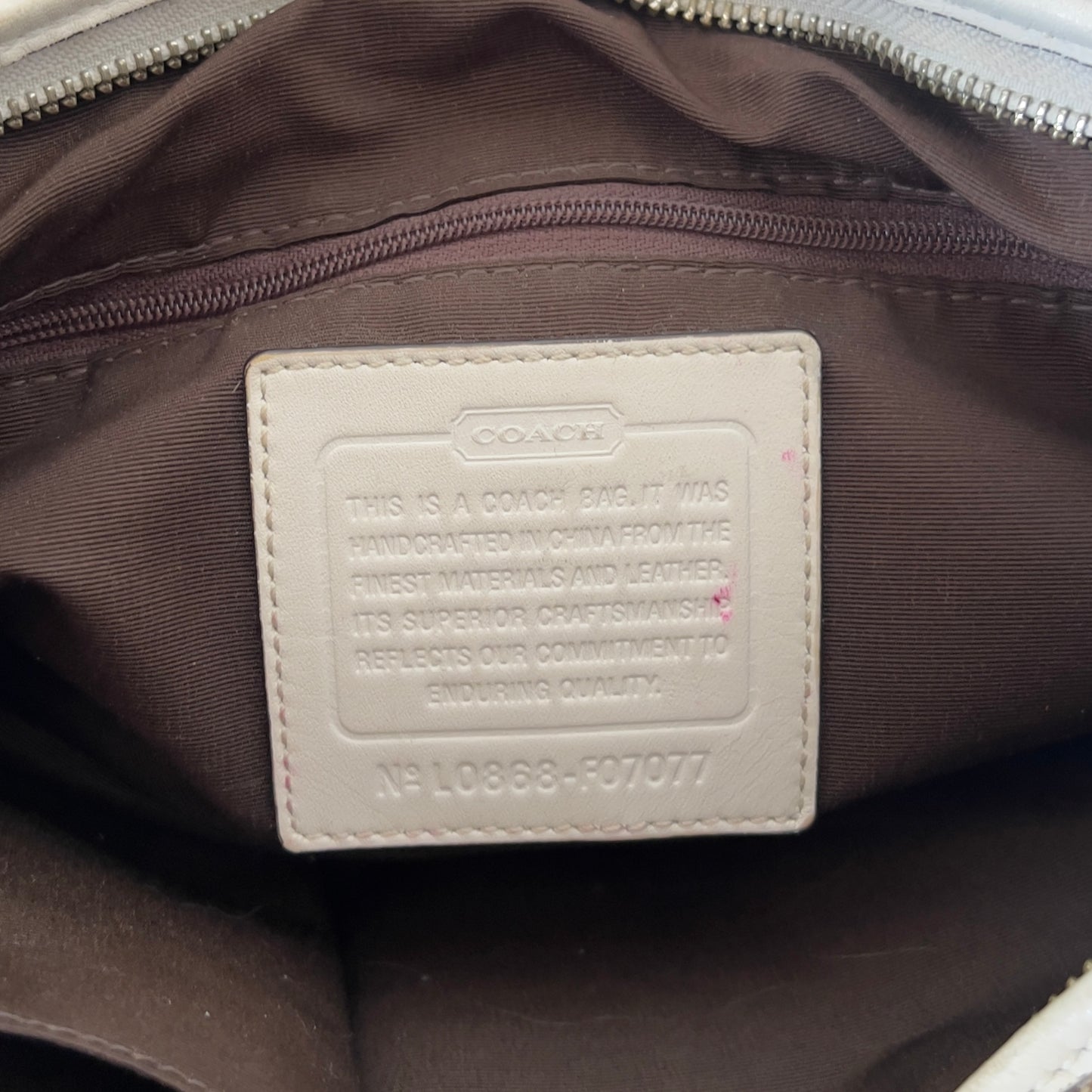 white signature Coach bag