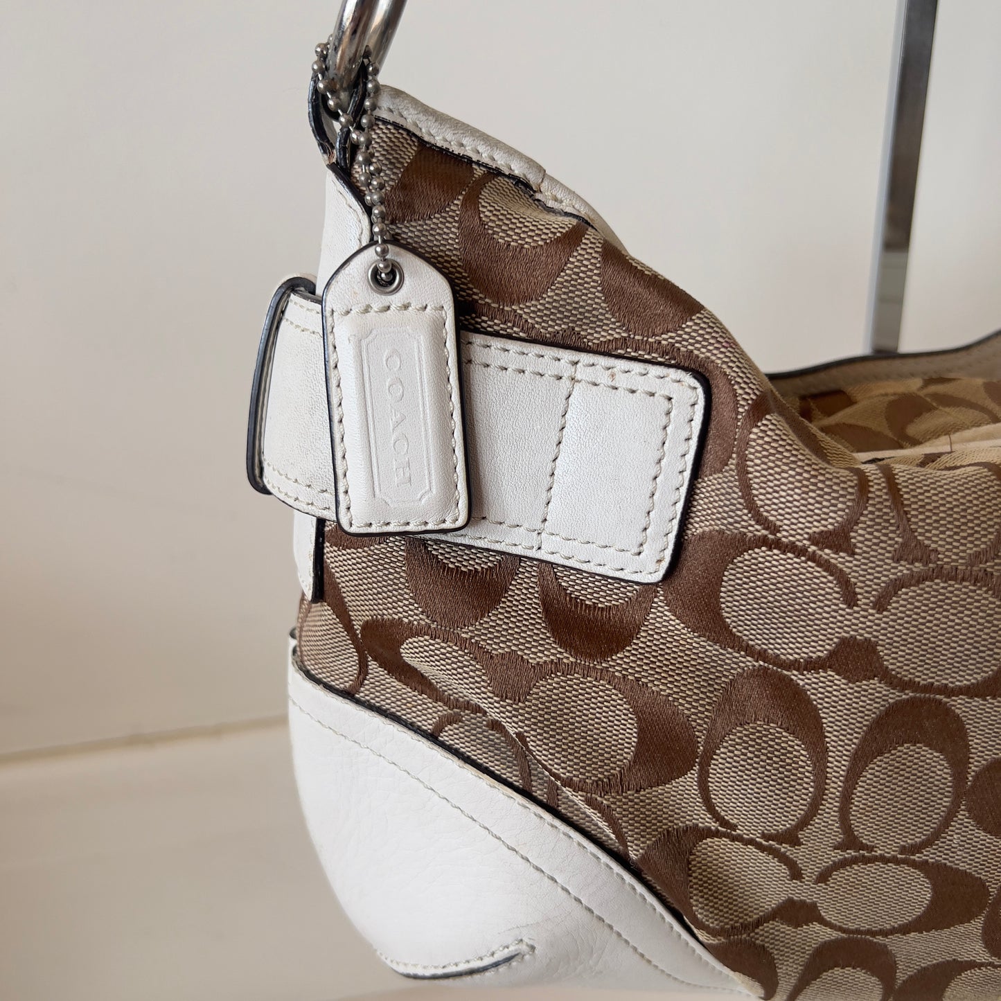 white signature Coach bag