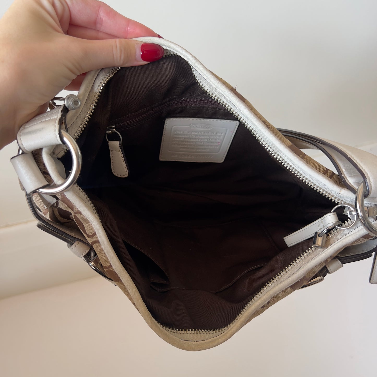 white signature Coach bag