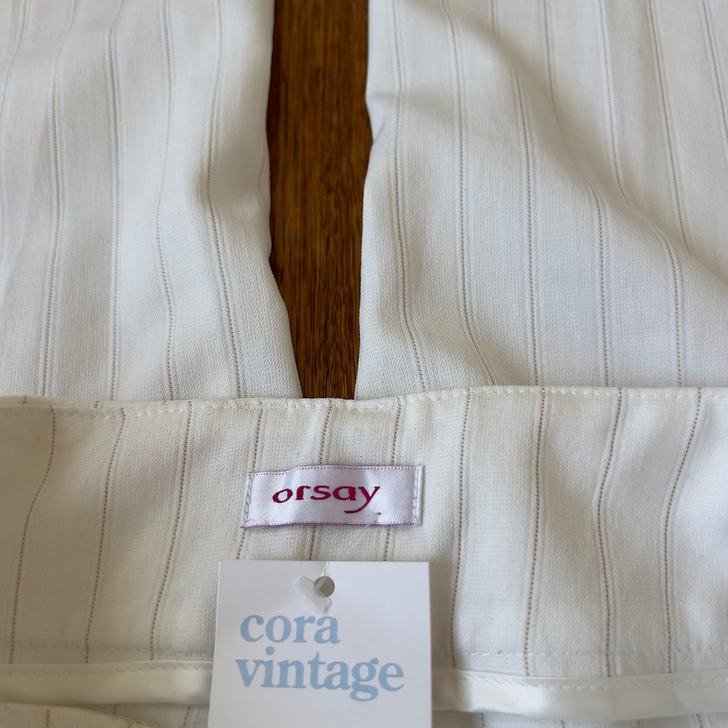 white pinstripe trousers