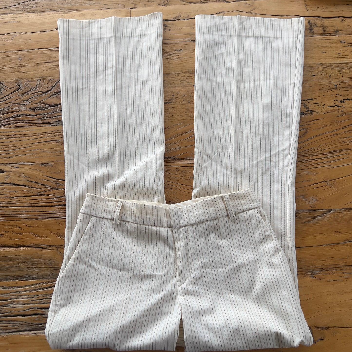 white pinstripe trousers