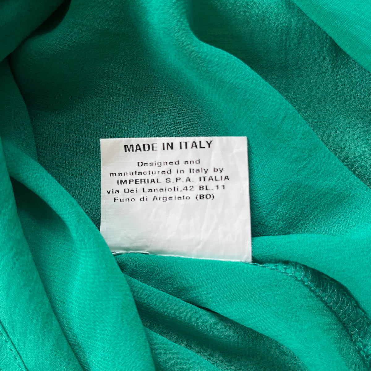 green frilly tunic top