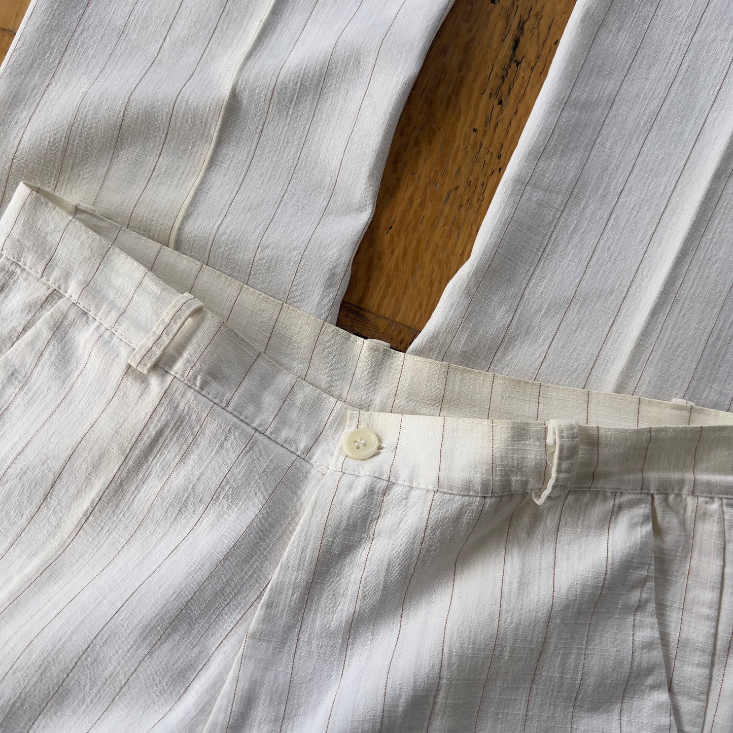 white pinstripe trousers