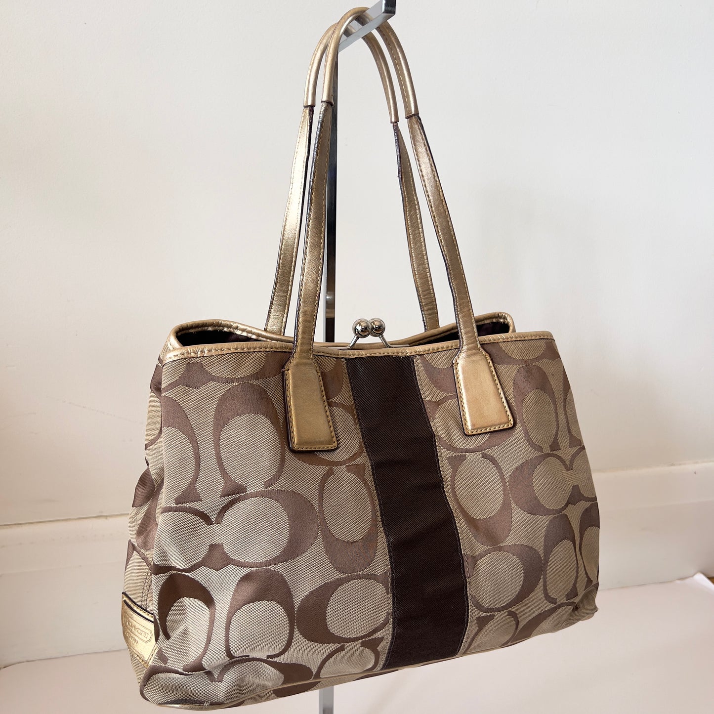 brown signature Coach bag