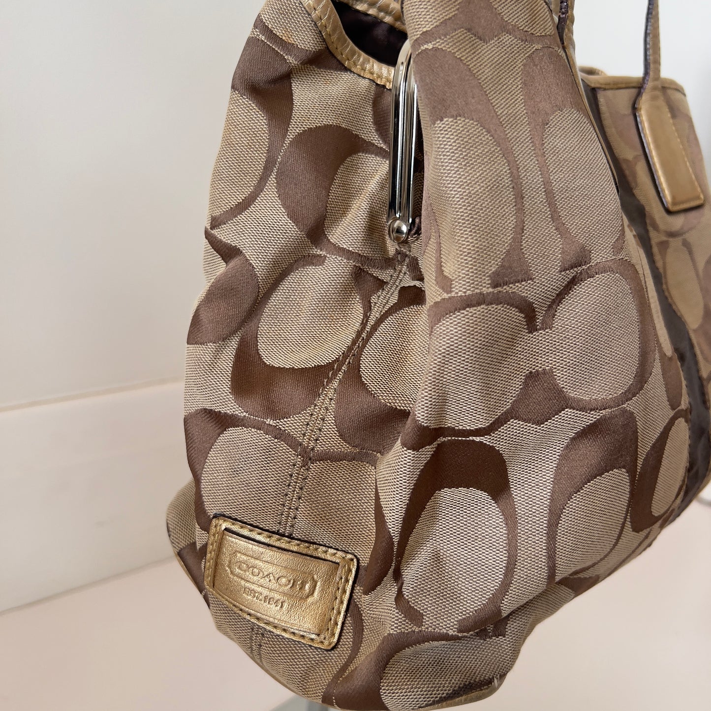 brown signature Coach bag
