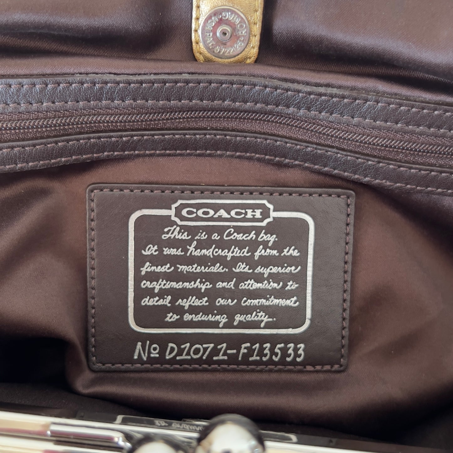 brown signature Coach bag
