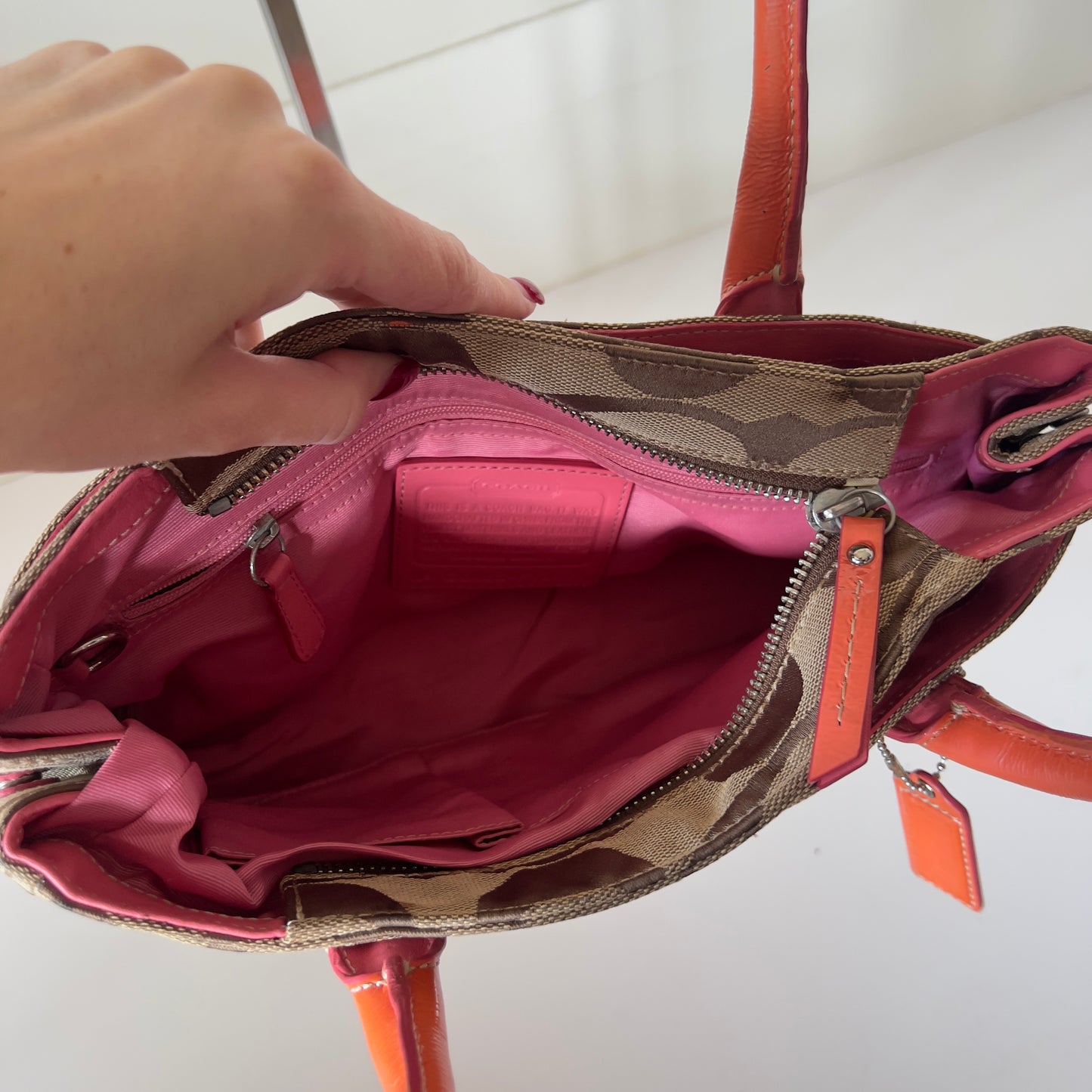 orange signature Coach bag