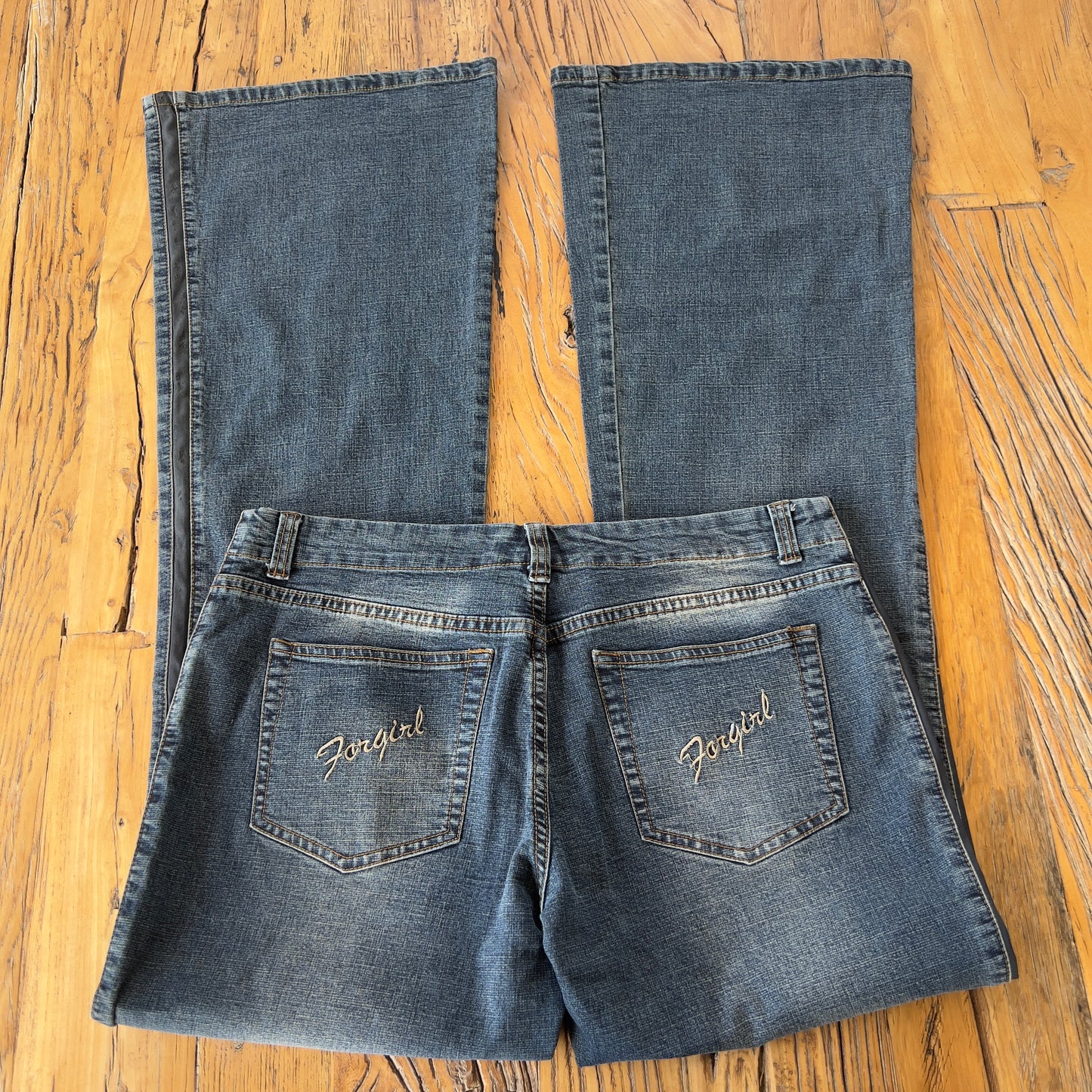 low rise flared stitched jeans
