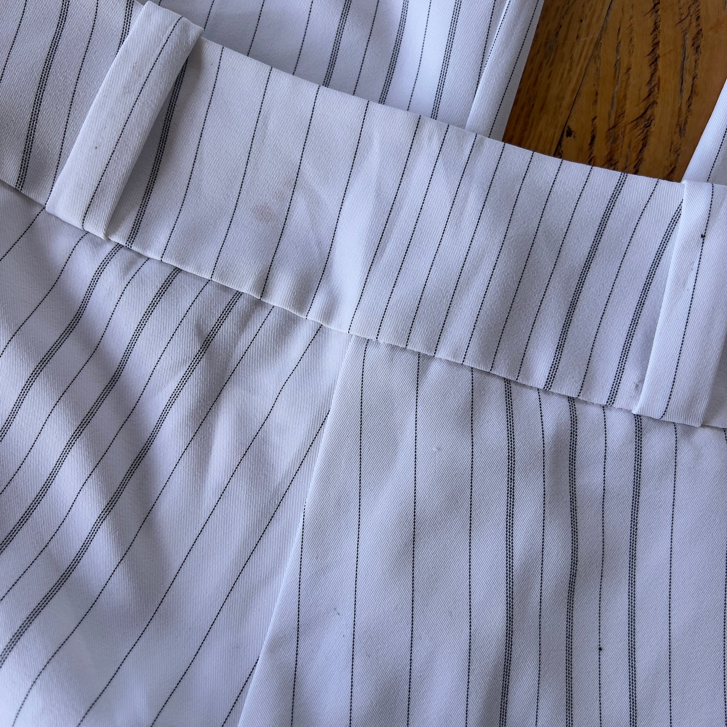 white pinstripe trousers