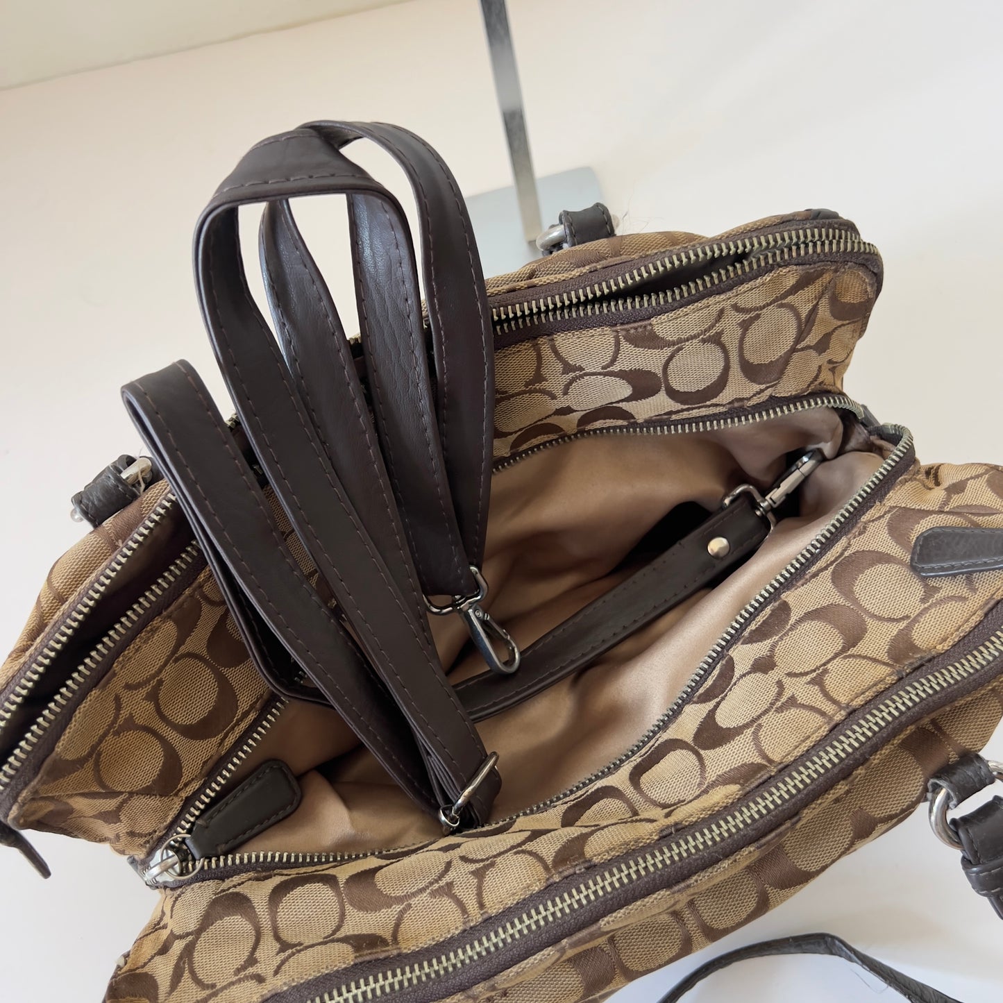 brown signature Coach bag