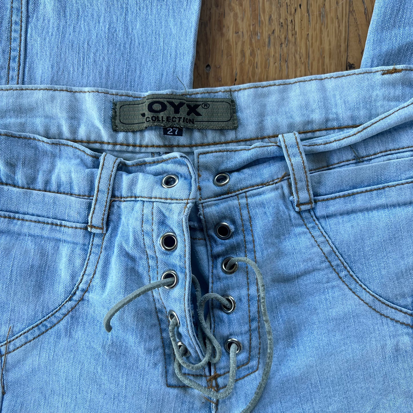 lace-up flared denim jeans