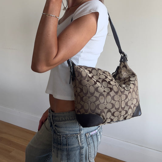 brown signature Coach hobo bag