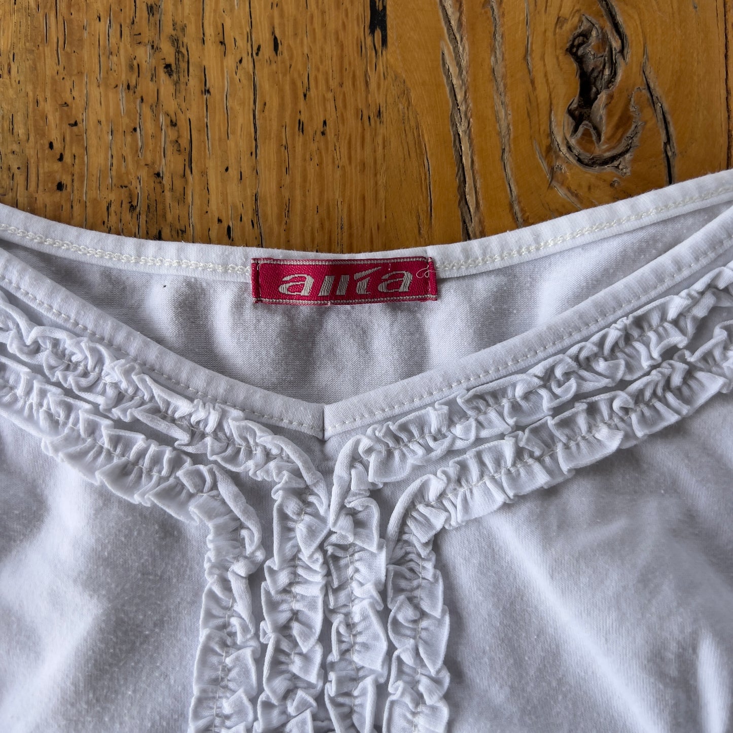 white frilly cami