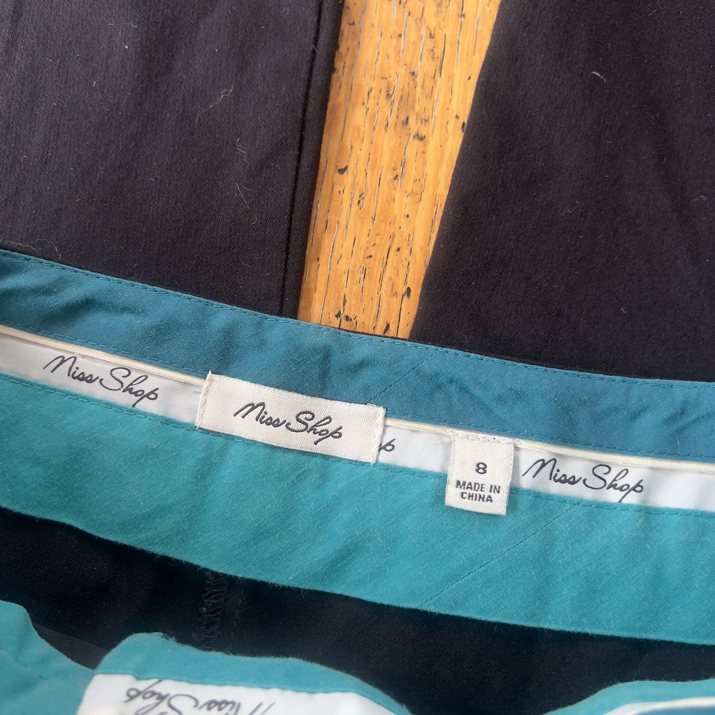 black low rise trousers