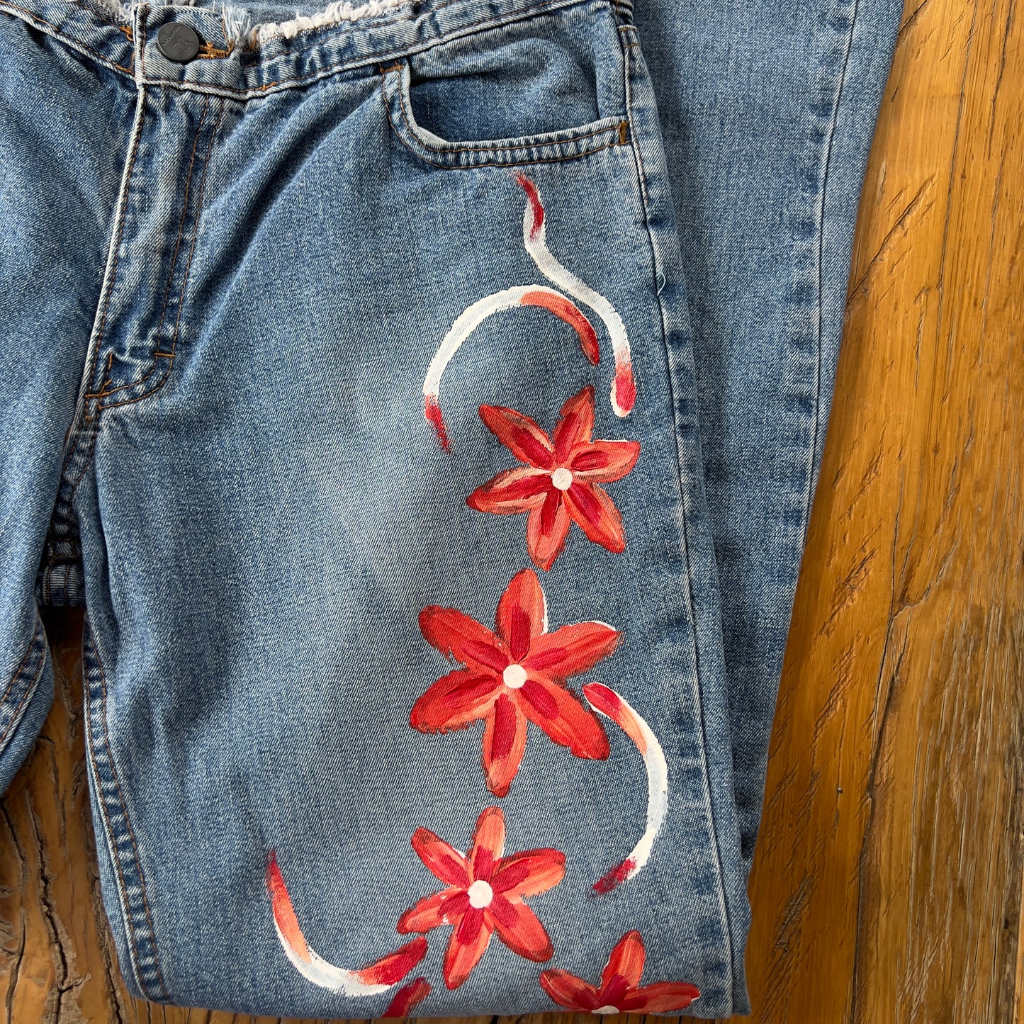 floral painted denim jeans