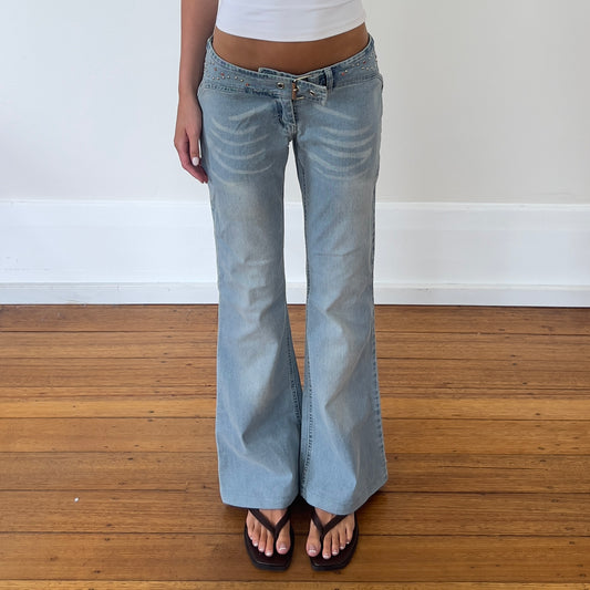 low rise flared buckle jeans