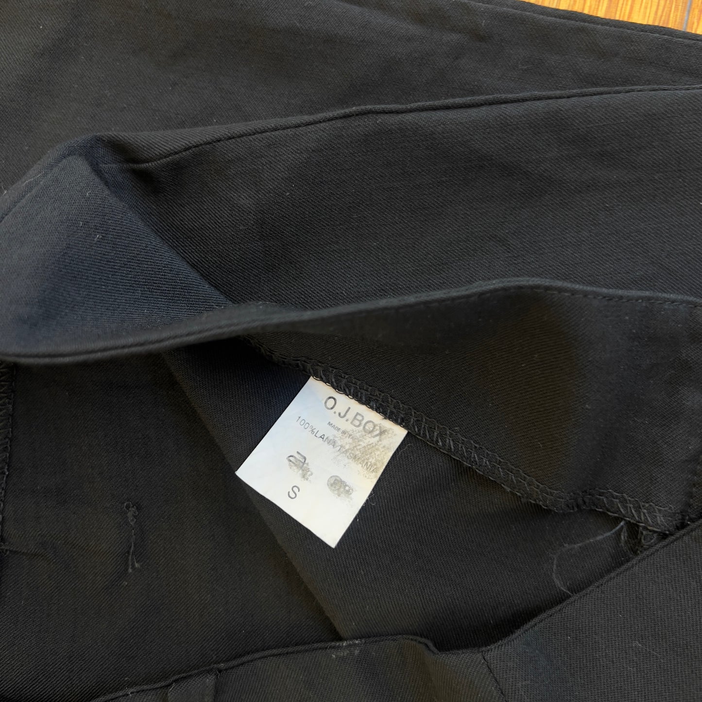 black low rise flared trousers