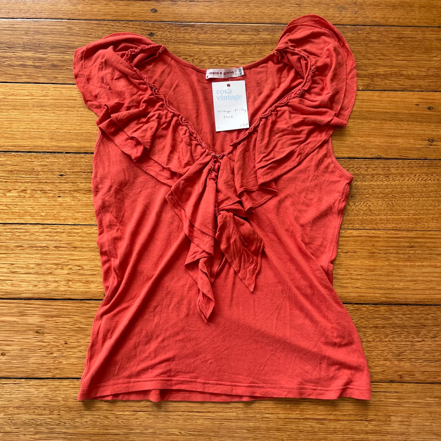 orange frilly tank