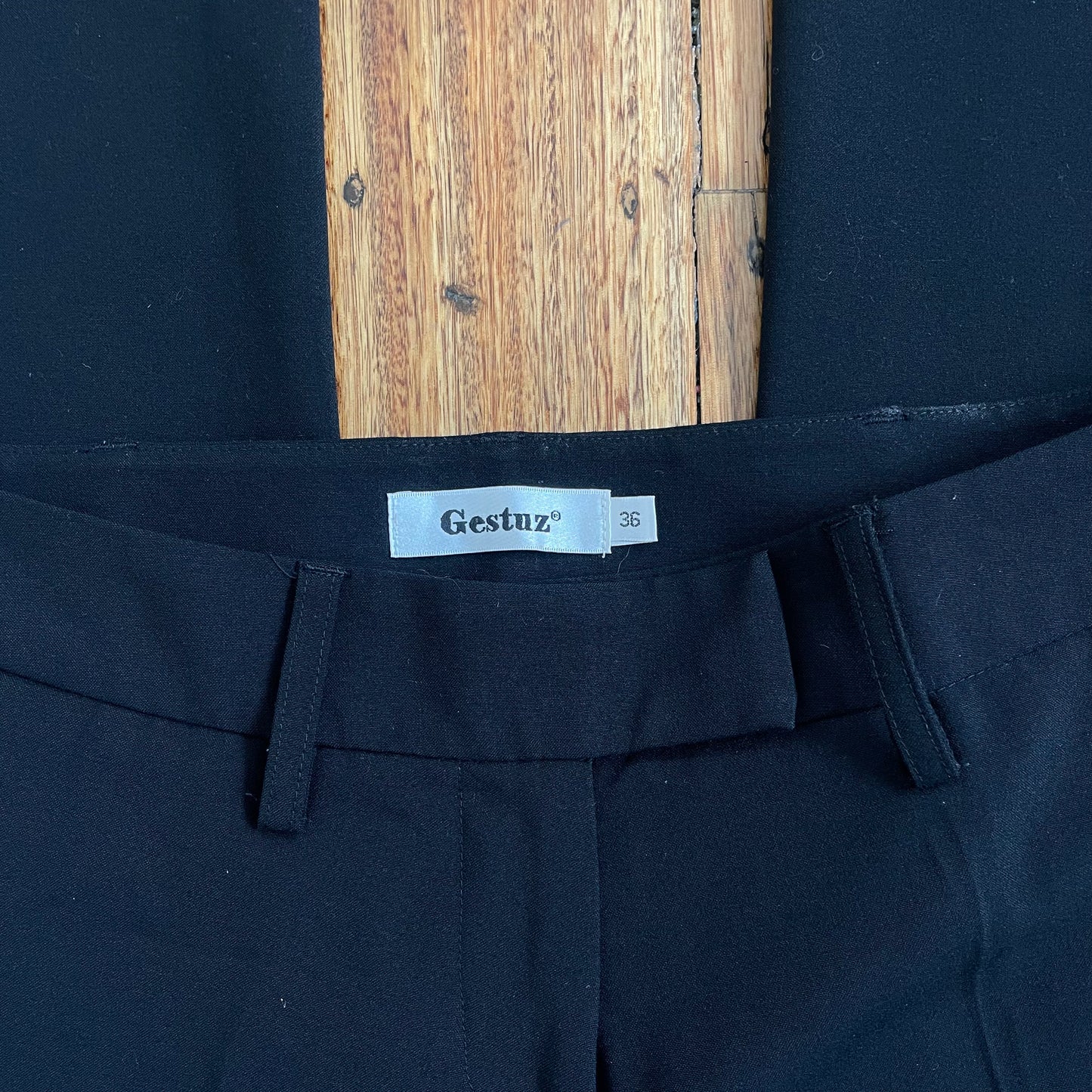black low rise trousers