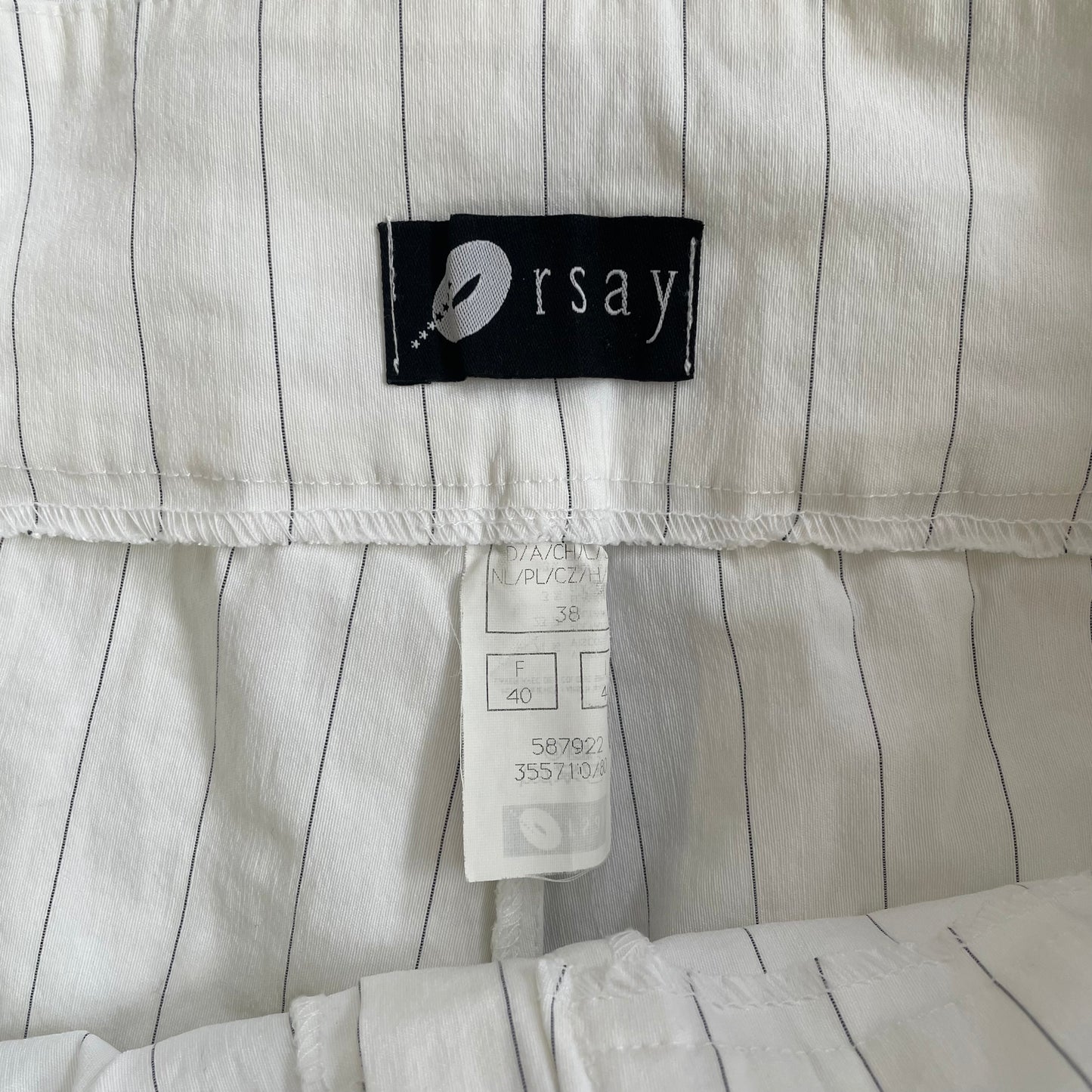 white pinstripe trousers