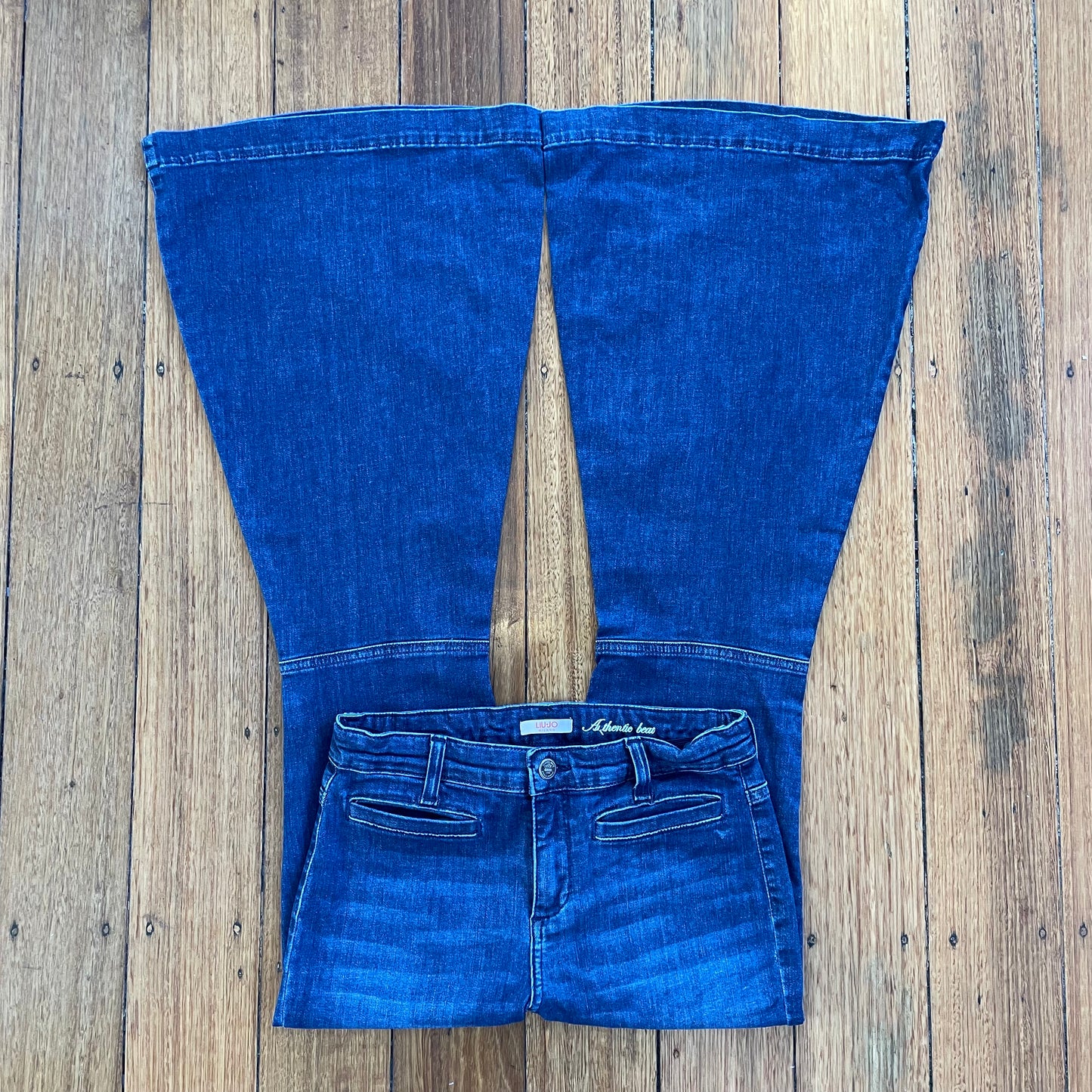 dark denim low rise flared jeans
