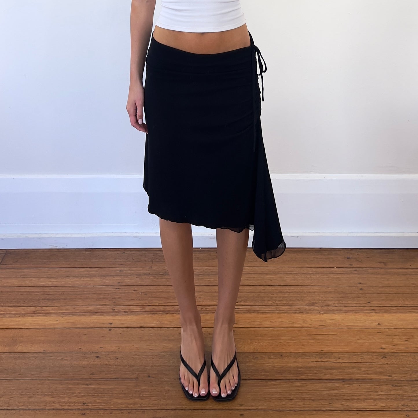 black asymmetrical midi skirt