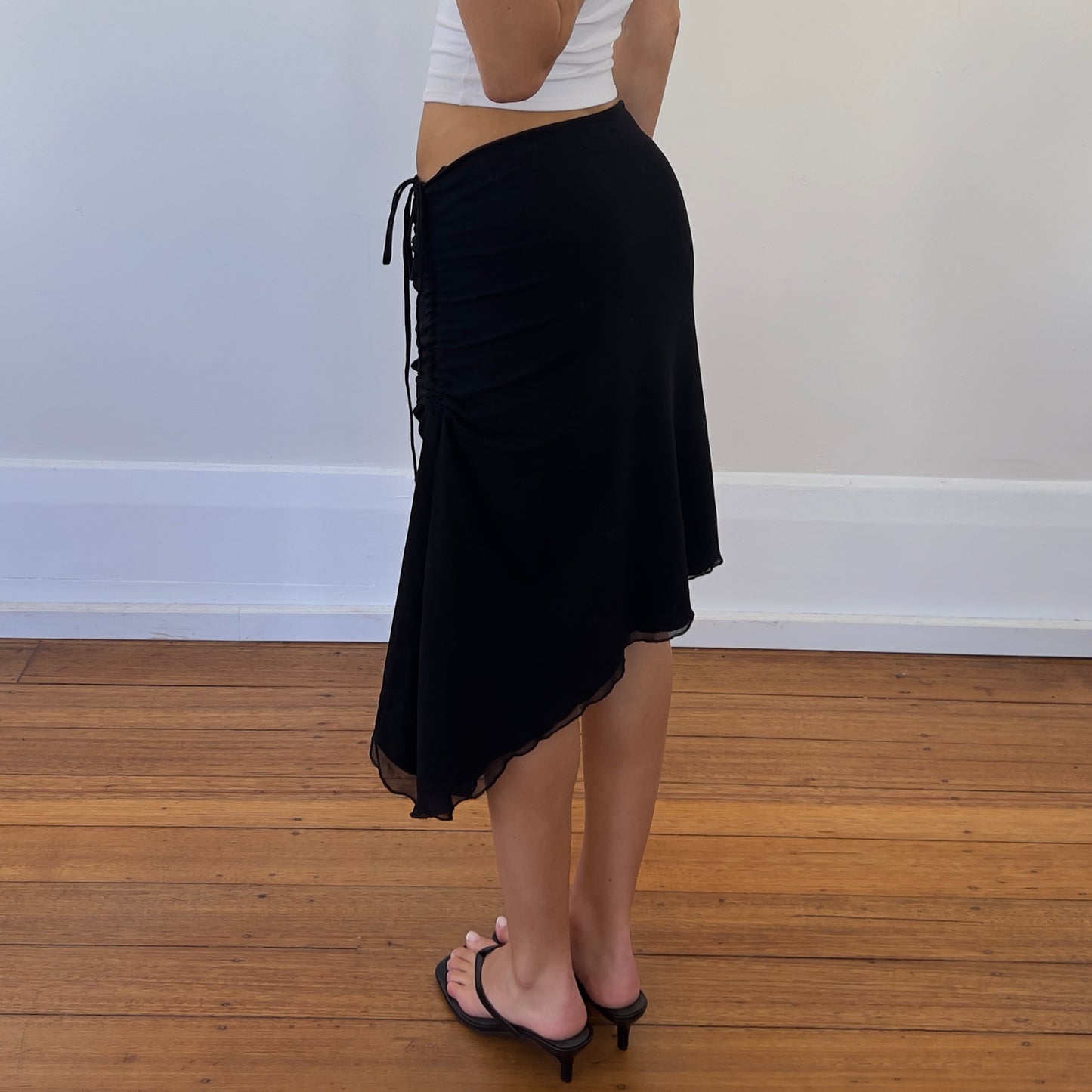 black asymmetrical midi skirt