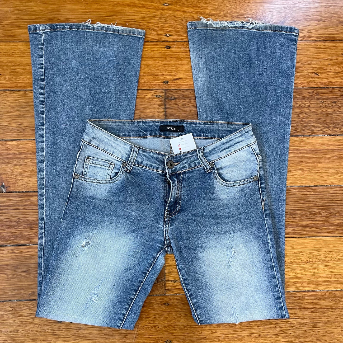 low rise bootcut ripped jeans