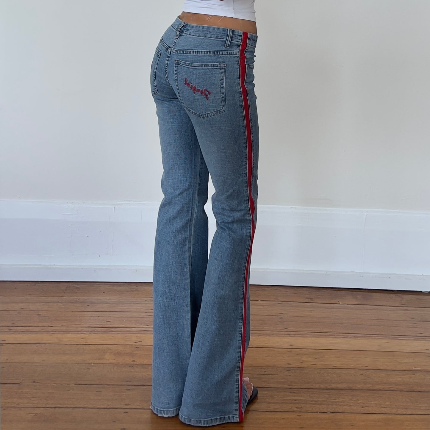 flared denim jeans with red detailing