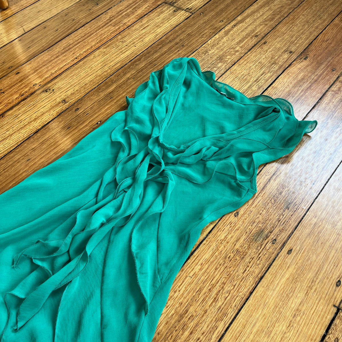 green frilly tunic top