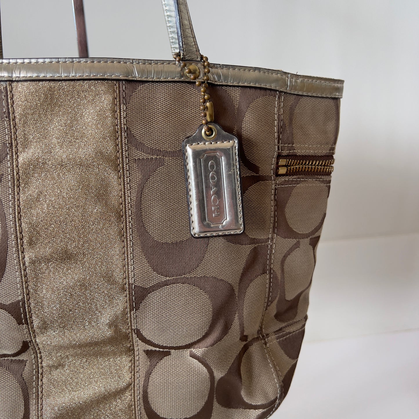 gold signature Coach bag
