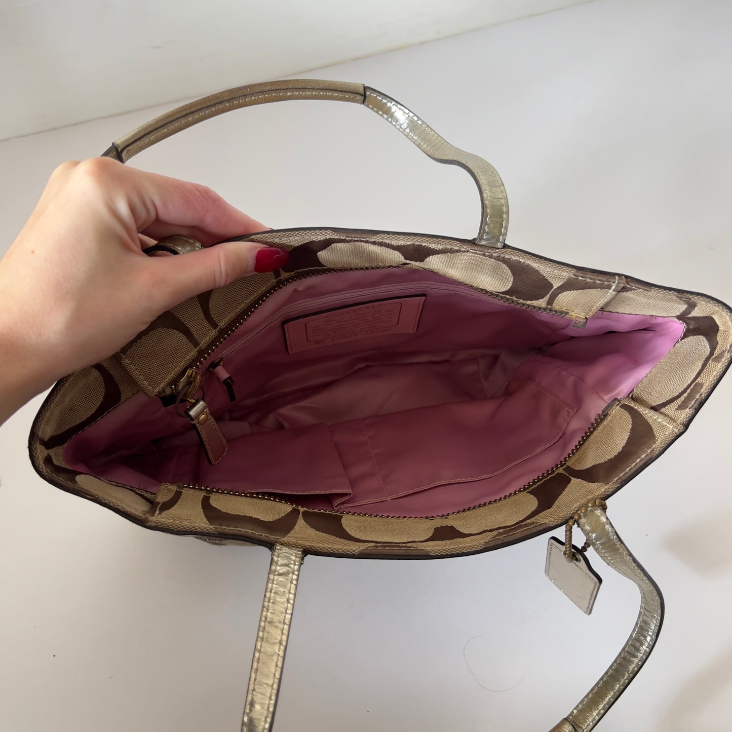 gold signature Coach bag