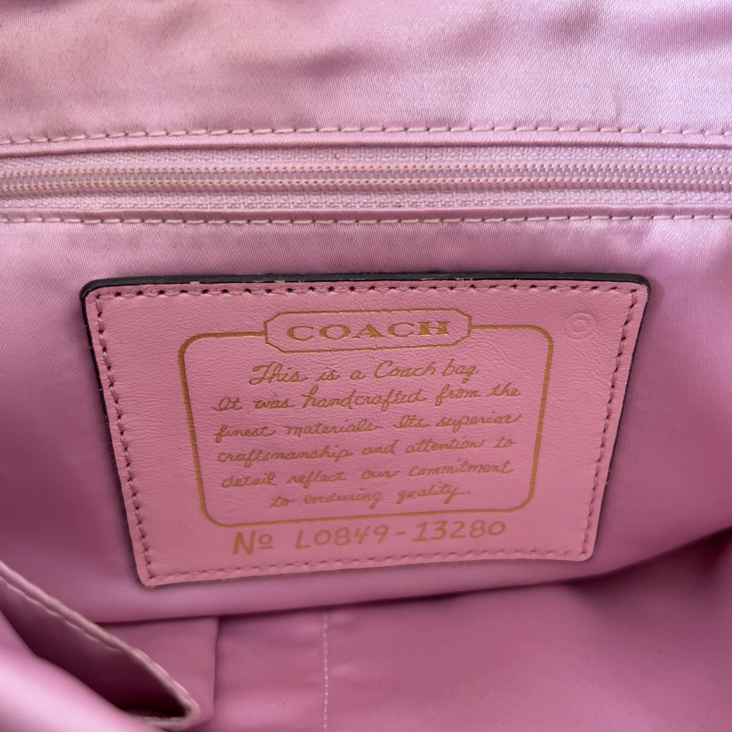 gold signature Coach bag