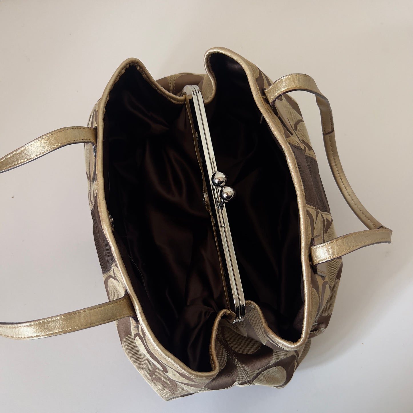 brown signature Coach bag