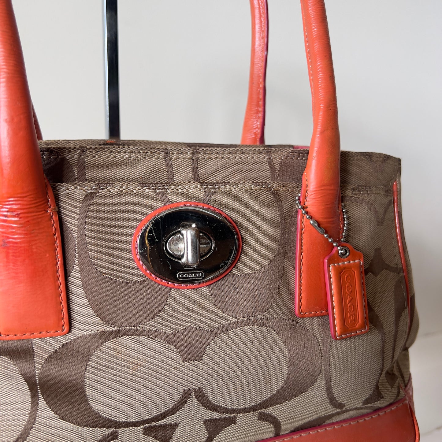 orange signature Coach bag