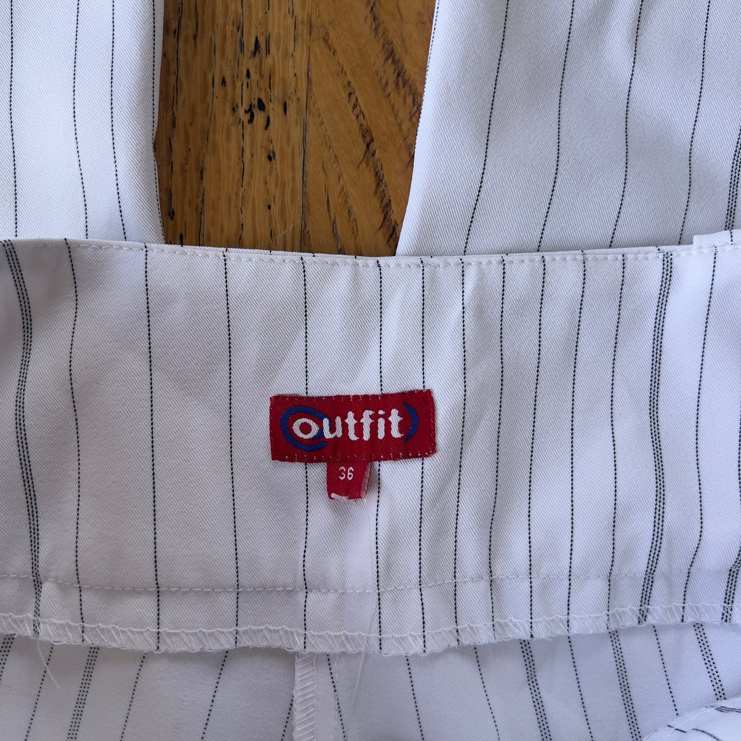 white pinstripe trousers