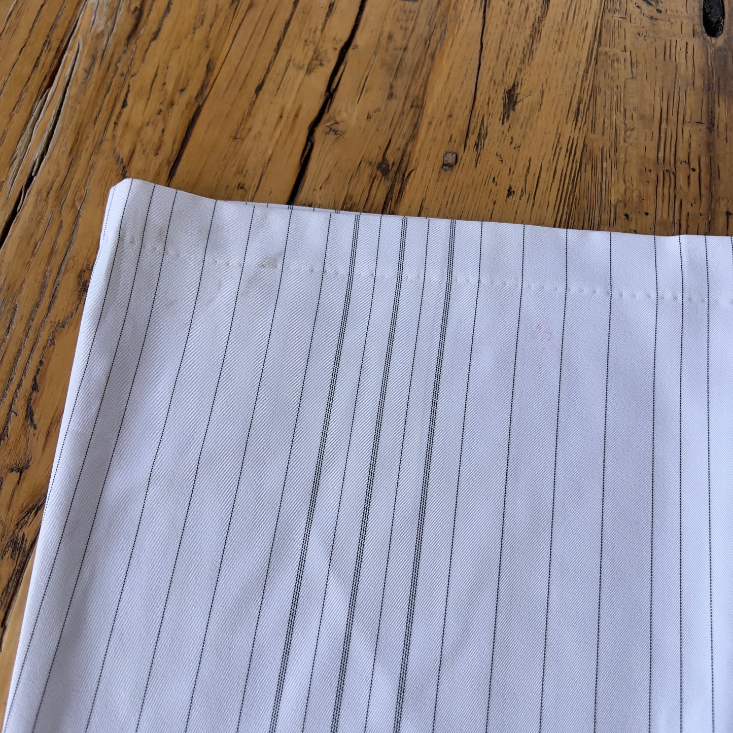white pinstripe trousers