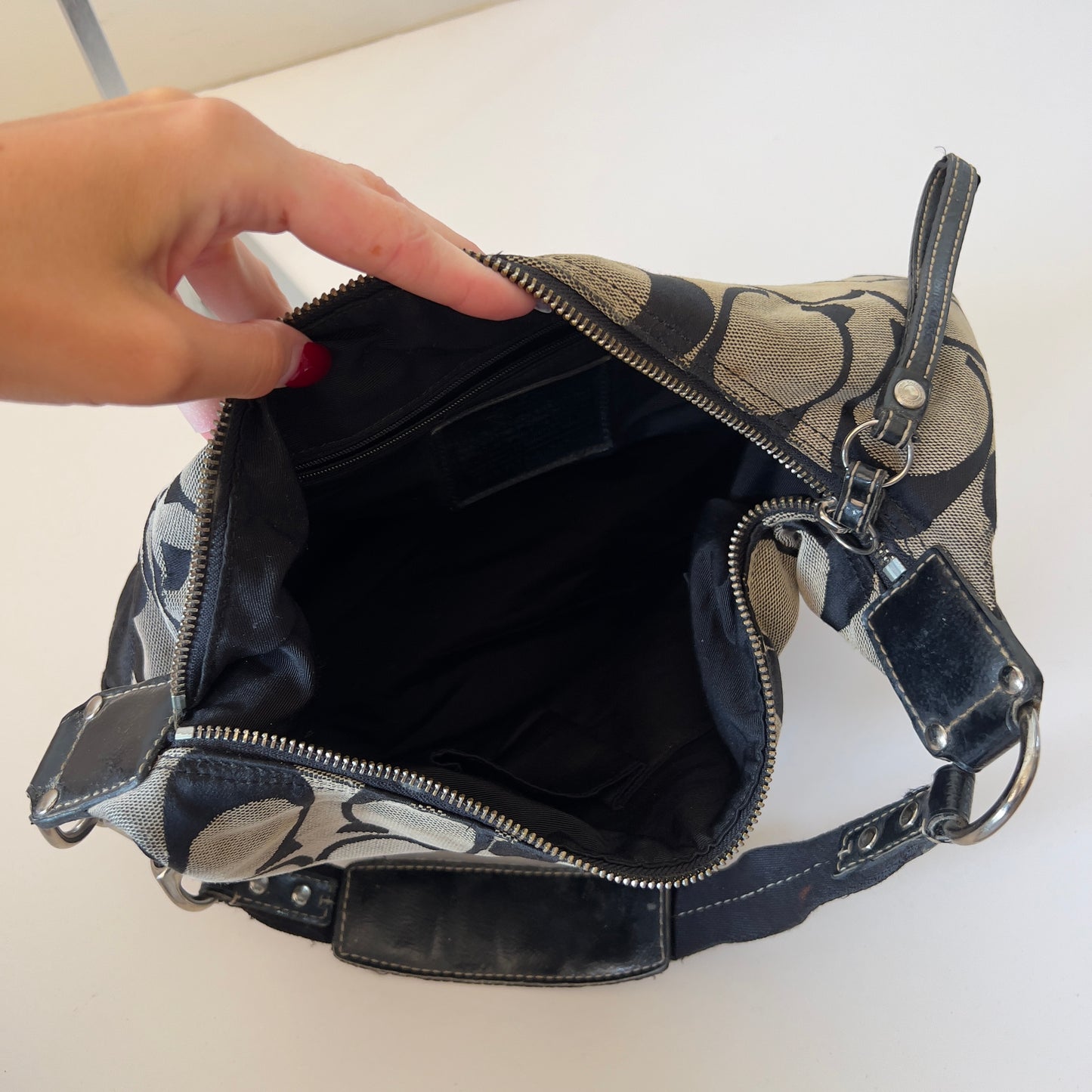 black signature Coach hobo bag