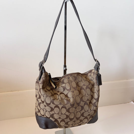 brown signature Coach hobo bag