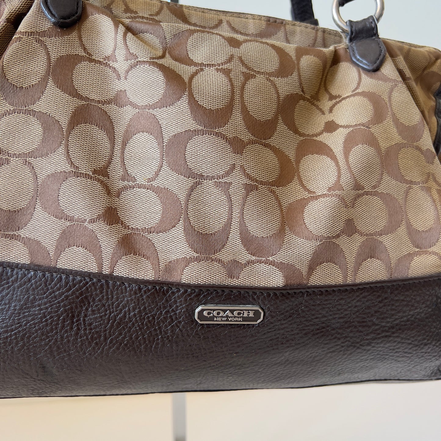 brown signature Coach bag
