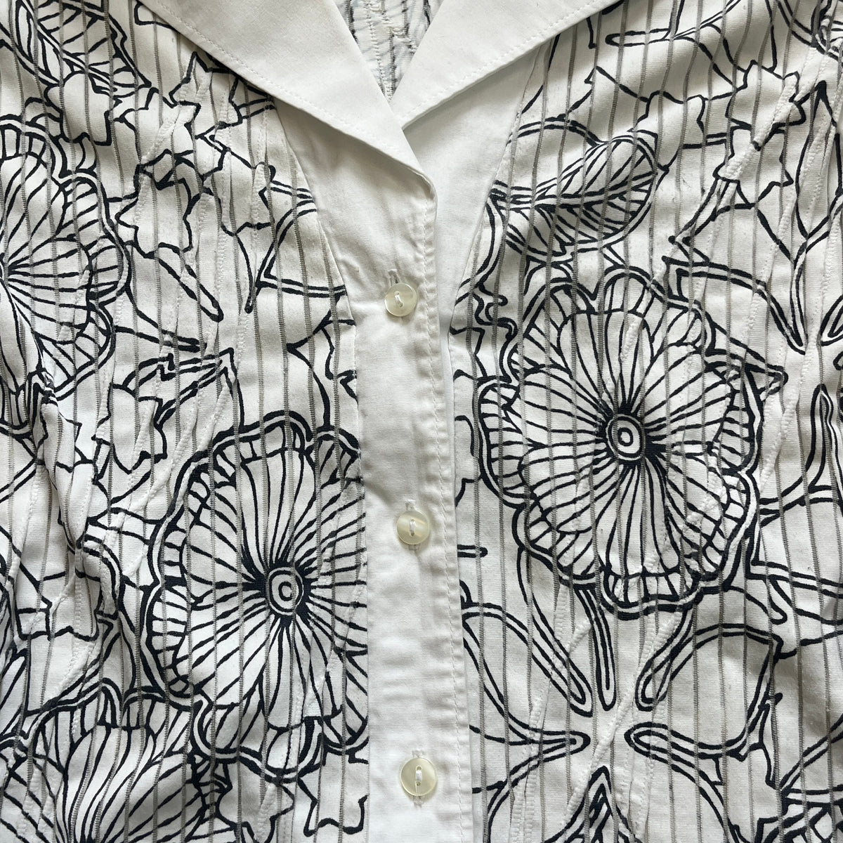 white graphic button-up shirt