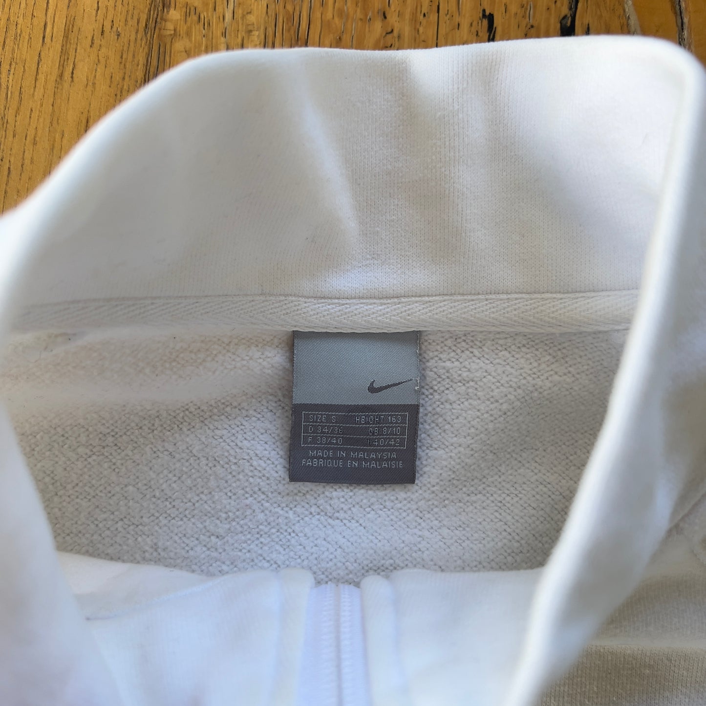 white 2000s Nike zip-up jacket
