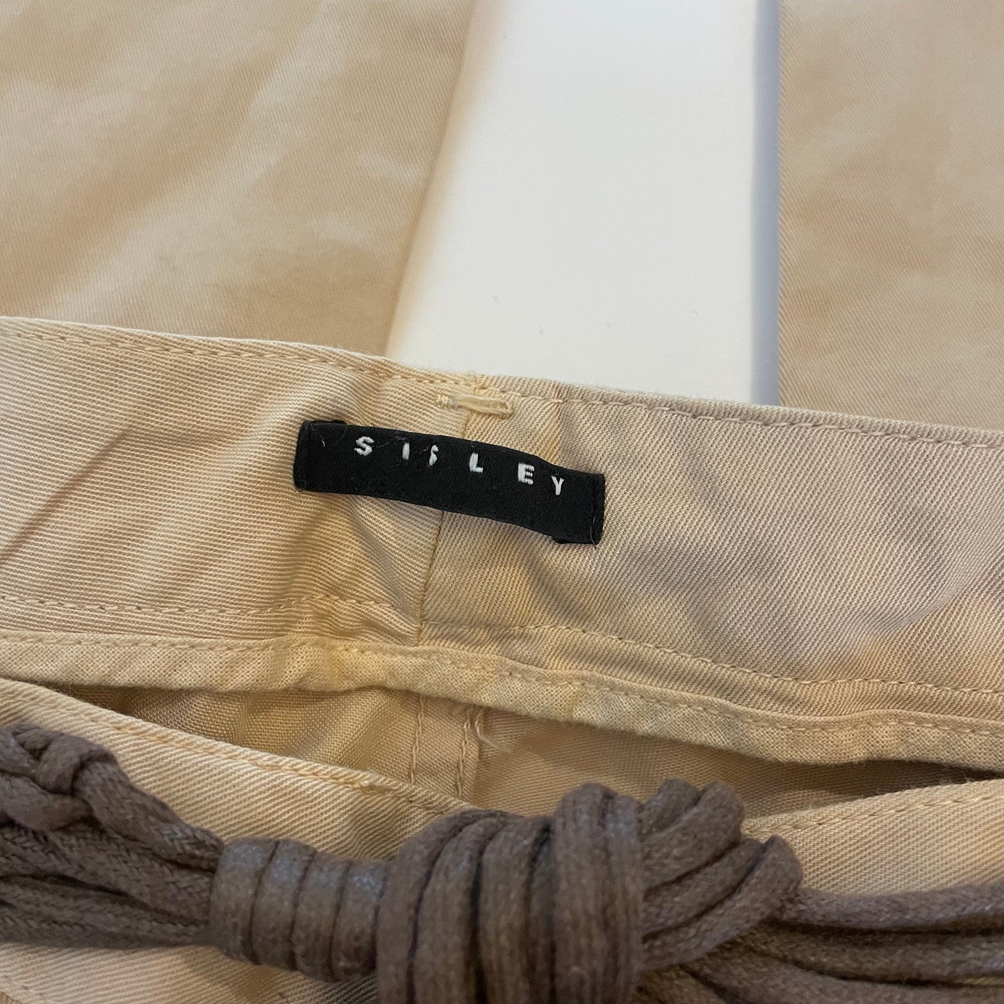 cream trousers w/ tassle belt