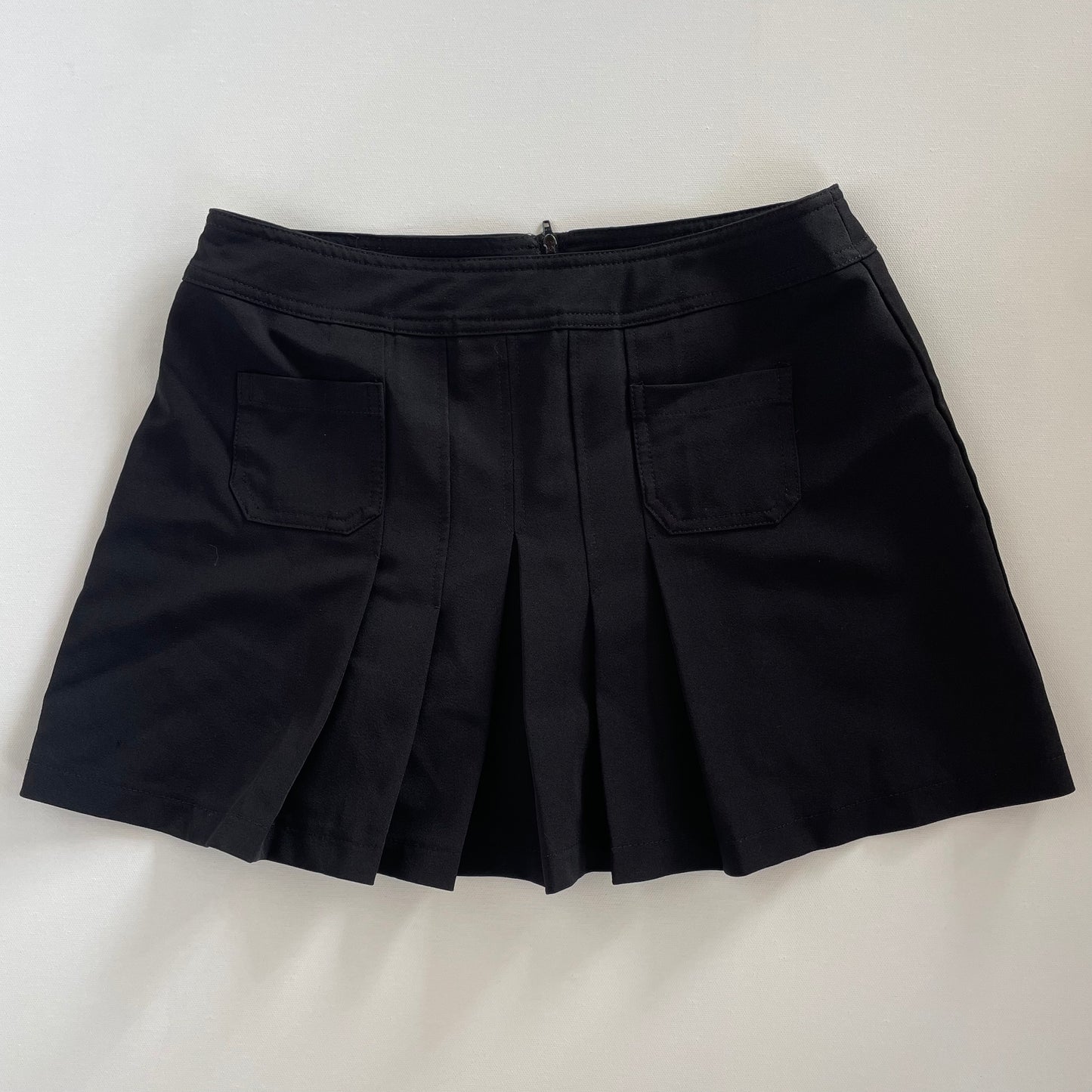 black pleated skirt