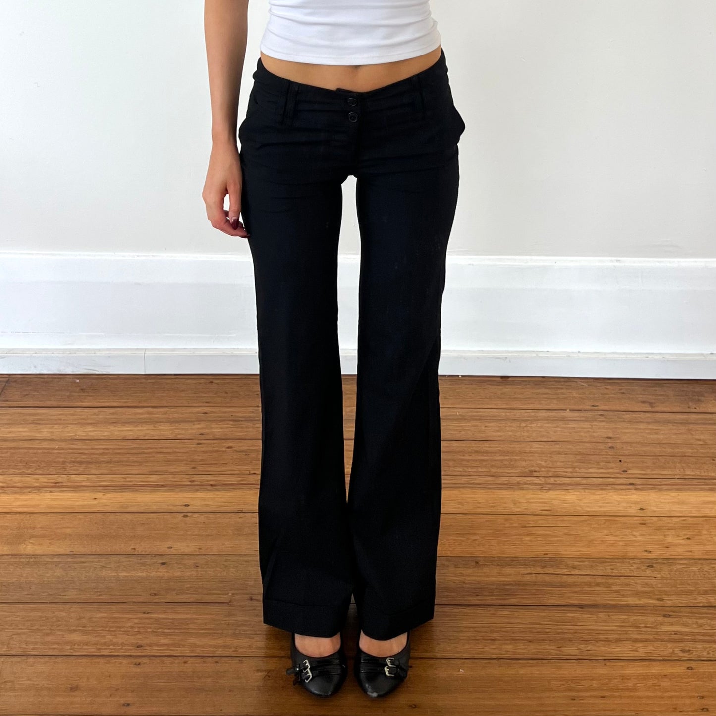 black low rise trousers