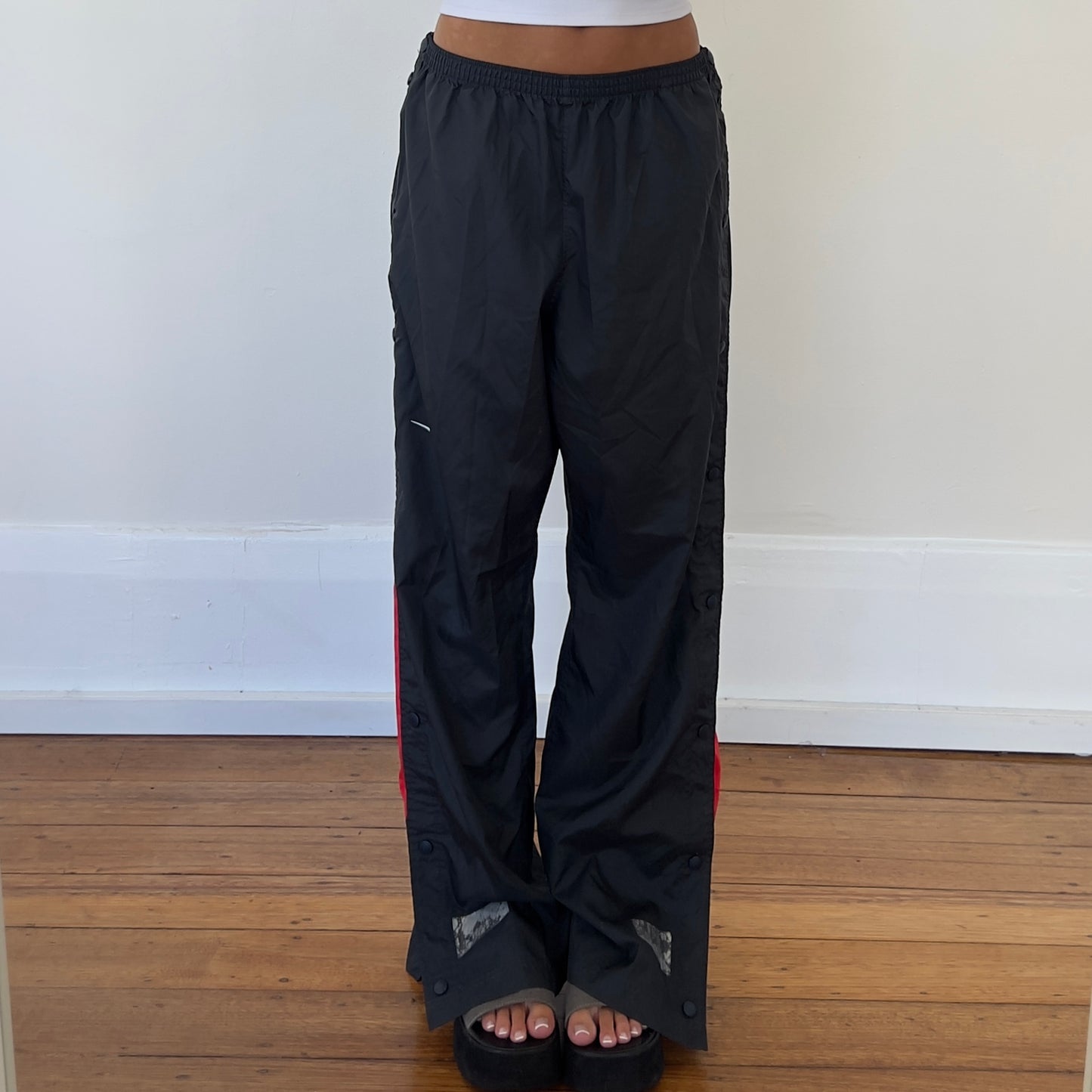 grey/red Nike track pants