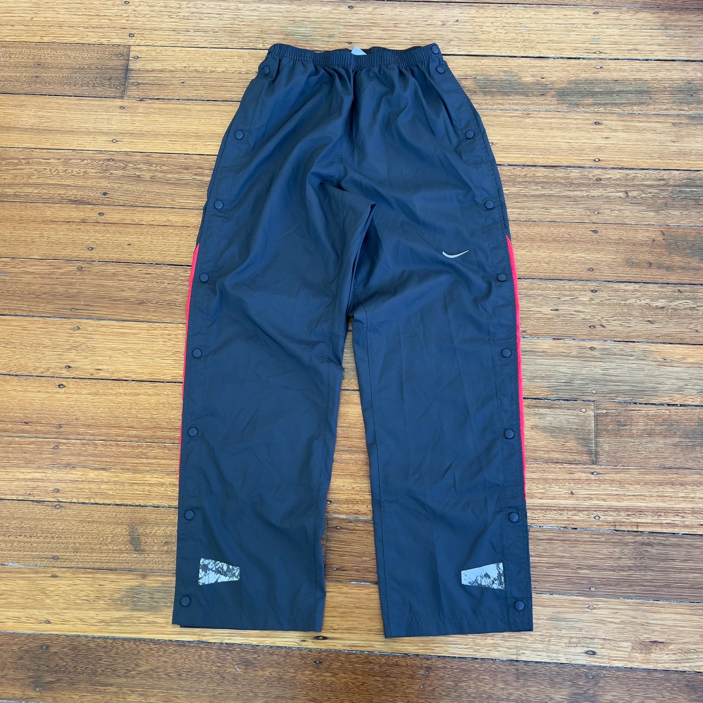 grey/red Nike track pants
