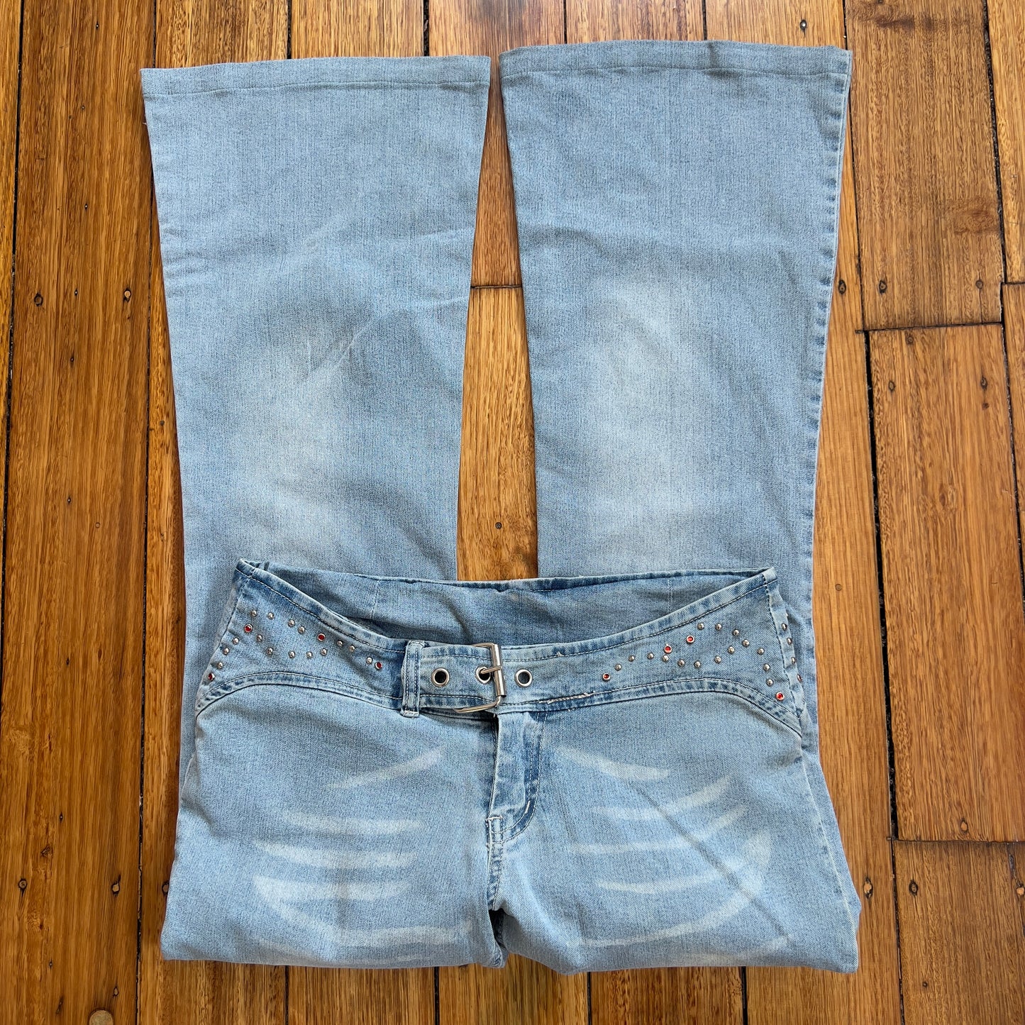 low rise flared buckle jeans
