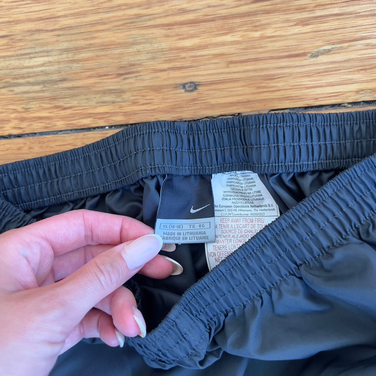 grey/red Nike track pants